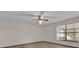 Bright bedroom with neutral walls, ceiling fan, and window with mini blinds at 2682 Orange Peel Ct, Orlando, FL 32806
