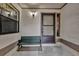 Front entry with a bench and screen door at 2682 Orange Peel Ct, Orlando, FL 32806