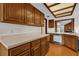 Kitchen boasts wood cabinets, neutral countertops, and modern appliances at 2682 Orange Peel Ct, Orlando, FL 32806
