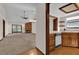 Living room with fireplace and view into kitchen at 2682 Orange Peel Ct, Orlando, FL 32806