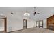 Living area with vaulted ceiling, ceiling fan, and access to other rooms at 2682 Orange Peel Ct, Orlando, FL 32806