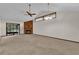 Spacious living room with a fireplace, vaulted ceiling and access to a screened porch at 2682 Orange Peel Ct, Orlando, FL 32806