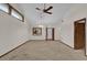 Open living room with high ceilings, a view of the kitchen, and plenty of natural light at 2682 Orange Peel Ct, Orlando, FL 32806
