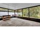 Enclosed porch with concrete flooring, providing extra outdoor space at 2682 Orange Peel Ct, Orlando, FL 32806