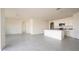Open-concept living area featuring modern tile flooring, recessed lighting, and a kitchen with stainless steel appliances at 2723 Sunkissed Dr, St Cloud, FL 34771