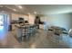 Open-concept kitchen and dining area with island seating and stainless steel appliances at 2723 Sunkissed Dr, St Cloud, FL 34771