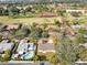 Neighborhood view with houses, trees, and a pool at 1116 Fairway Dr, Winter Park, FL 32792