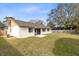 Large backyard with grassy area and wooden fence at 1116 Fairway Dr, Winter Park, FL 32792