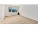 Simple carpeted bedroom with neutral walls and large window at 1116 Fairway Dr, Winter Park, FL 32792