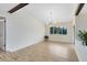 Bright dining room with wood-look floors and a modern chandelier at 1116 Fairway Dr, Winter Park, FL 32792