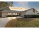 Single-story house with attached garage and landscaping at 1116 Fairway Dr, Winter Park, FL 32792