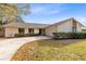 Single-story house with attached garage and landscaping at 1116 Fairway Dr, Winter Park, FL 32792