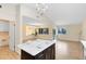 Open concept kitchen with island, looking into living area at 1116 Fairway Dr, Winter Park, FL 32792