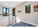 Upper hallway with modern lighting and stone wall at 1970 Laurel Rd, Winter Park, FL 32789