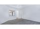 Bright, carpeted bedroom with window providing natural light and neutral walls at 3032 Parkway Blvd # 302, Kissimmee, FL 34747