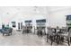 Inviting common area featuring cozy seating arrangements, ample tables, and views of lush landscaping at 3032 Parkway Blvd # 302, Kissimmee, FL 34747