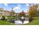 Serene community pond with fountain feature surrounded by lush greenery at 3032 Parkway Blvd # 302, Kissimmee, FL 34747