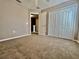 Bedroom featuring a closet and entryway, offering ample storage space and easy accessibility at 7128 Five Oaks Dr, Harmony, FL 34773