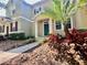 Attractive two-story home with vibrant landscaping and well-maintained facade at 7128 Five Oaks Dr, Harmony, FL 34773