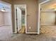 Hallway with doors leading to the bathroom, bedroom, and other rooms, providing convenient access to different parts of the home at 7128 Five Oaks Dr, Harmony, FL 34773