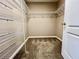 Walk-in closet featuring wire shelving maximizing storage space for clothes, shoes, and accessories at 7128 Five Oaks Dr, Harmony, FL 34773