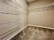 Walk-in closet featuring wire shelving maximizing storage space for clothes, shoes, and accessories at 7128 Five Oaks Dr, Harmony, FL 34773
