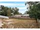 Spacious backyard with a wooden fence at 1209 Baranova Rd, Ocoee, FL 34761