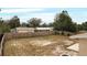 Large backyard with a wooden fence and mature trees at 1209 Baranova Rd, Ocoee, FL 34761