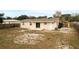 Home's backyard, featuring a patio and large yard at 1209 Baranova Rd, Ocoee, FL 34761