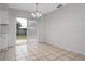 Bright dining area with sliding glass doors leading to the backyard at 1209 Baranova Rd, Ocoee, FL 34761