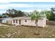 Updated single story home with a palm tree and walkway at 1209 Baranova Rd, Ocoee, FL 34761