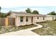 Renovated single story home with a walkway leading to the front porch at 1209 Baranova Rd, Ocoee, FL 34761