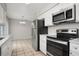 Eat-in kitchen with stainless steel appliances and ample cabinet space at 1209 Baranova Rd, Ocoee, FL 34761