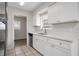 Updated kitchen featuring white cabinets and stainless steel appliances at 1209 Baranova Rd, Ocoee, FL 34761