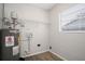 Laundry room with water heater and shelving at 1209 Baranova Rd, Ocoee, FL 34761