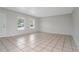 Spacious living area with tile floors and neutral color palette at 1209 Baranova Rd, Ocoee, FL 34761
