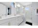 Double vanity bathroom with a large shower and modern fixtures at 13104 Markowitz Aly, Orlando, FL 32827