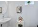 Small bathroom with a sink, small vanity, and framed art at 13104 Markowitz Aly, Orlando, FL 32827