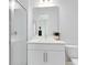 Modern bathroom with a white vanity, glass shower, and updated fixtures at 13104 Markowitz Aly, Orlando, FL 32827