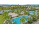 Aerial view of community pools, lush landscaping, and recreational areas at 13104 Markowitz Aly, Orlando, FL 32827