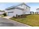 Attached garage with driveway and landscaping at 13104 Markowitz Aly, Orlando, FL 32827