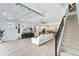 Open living area with high ceilings, modern fireplace, and large windows at 13104 Markowitz Aly, Orlando, FL 32827