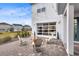 Relaxing patio with string lights and comfortable seating, showcasing the garage at 13104 Markowitz Aly, Orlando, FL 32827