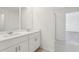 Bright bathroom featuring double vanity, modern fixtures, and tile flooring at 2949 Wild Olive Dr, St Cloud, FL 34772
