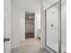 Bright bathroom featuring modern tile floors, and a glass enclosed standing shower at 2949 Wild Olive Dr, St Cloud, FL 34772