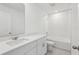 Bright bathroom boasts a sink, vanity, walk-in shower, and bathtub at 2949 Wild Olive Dr, St Cloud, FL 34772