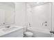The bathroom features a sleek vanity and a shower-tub combo with white tiling at 2949 Wild Olive Dr, St Cloud, FL 34772