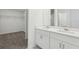 Modern bathroom featuring dual sinks, vanity, and a spacious walk-in closet at 2949 Wild Olive Dr, St Cloud, FL 34772