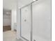 Modern bathroom with walk-in shower and tiled floors, perfect for a spa-like experience at 2949 Wild Olive Dr, St Cloud, FL 34772