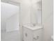 Upstairs bathroom featuring a vanity and open doorway to a bedroom at 2949 Wild Olive Dr, St Cloud, FL 34772